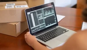 Small business owner managing cybersecurity from a laptop
